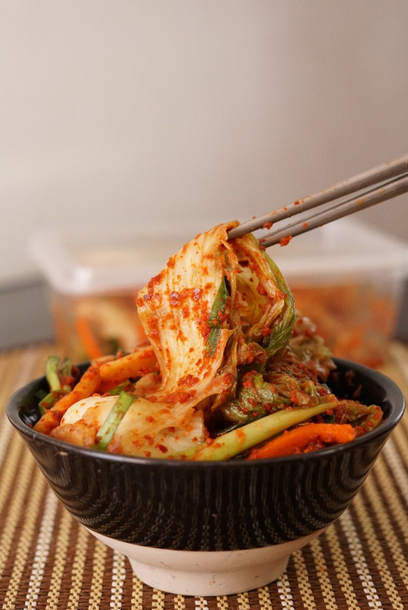 Homemade Korean kimchi fermenting in a bowl