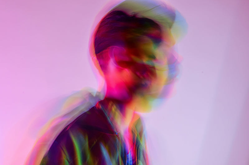 Person taking a dietary supplement with depiction of gut-brain connection