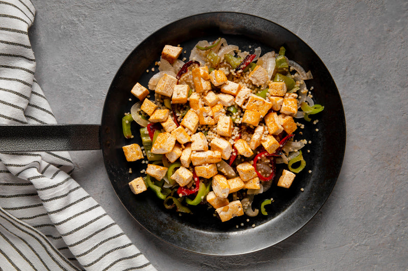 High-protein tofu scramble with vegetables served in a skillet